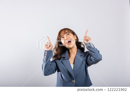 Asian happy portrait beautiful cute young business woman standing makes gesture two fingers pointing upwards above presenting product something, studio shot isolated on white background, point up Asian happy portrait beautiful cute young business woman standing makes gesture two fingers pointing upwards above presenting product something, studio shot isolated on white background, point up 122221902