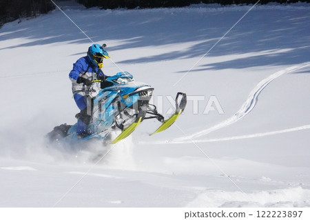 Snowmobile gliding Snowmobile gliding 122223897