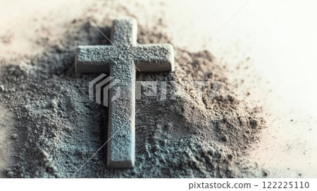 Cross is on top of a pile of sand 122225110