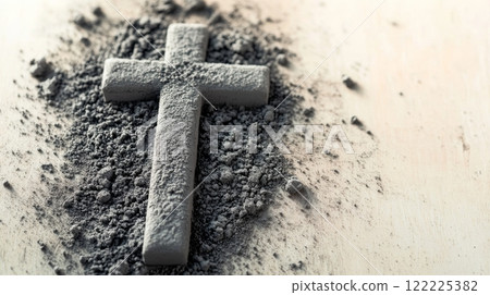 Cross is on a table covered in dirt 122225382