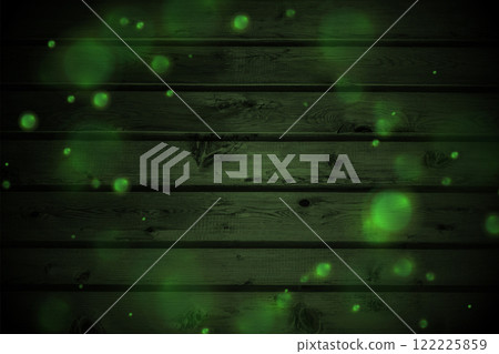Green glowing bokeh lights on dark wooden wall Green glowing bokeh lights on dark wooden wall 122225859