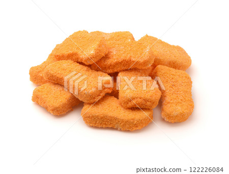 Heap of frozen breaded fish nuggets Heap of frozen breaded fish nuggets 122226084