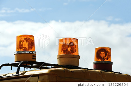 yellow emergency light on the car. Light signal on special equipment orange light siren. 122226204