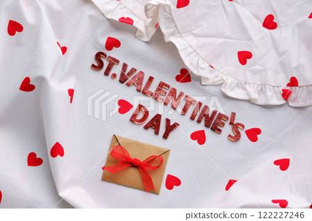 Festive St. Valentine's Day background of a white cotton blouse with hearts. 122227246