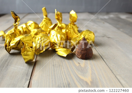 Candy truffle on a gray background. Chocolate Candy Day Candy truffle on a gray background. Chocolate Candy Day 122227460