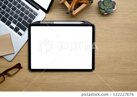 Creative workspace with digital tablet, laptop, glasses and office essentials Creative workspace with digital tablet, laptop, glasses and office essentials 122227676