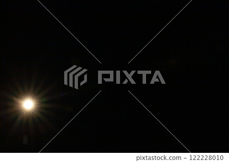 Sun flare on the black background 122228010