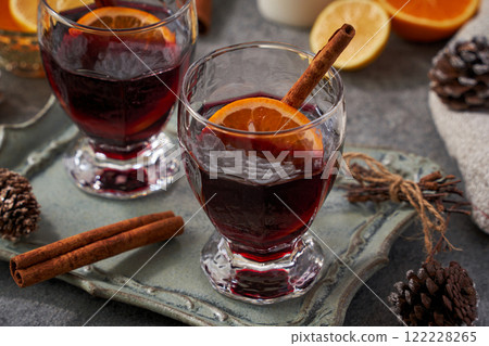 Winter mulled wine cocktail with orange and cinnamon Winter mulled wine cocktail with orange and cinnamon 122228265