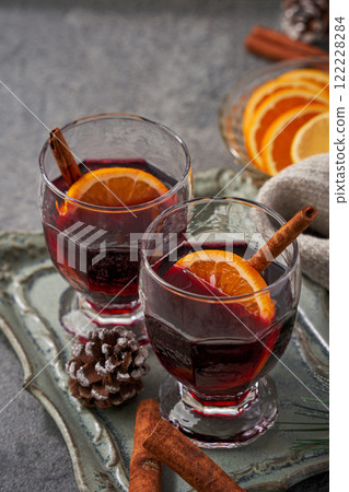 Winter mulled wine cocktail with orange and cinnamon Winter mulled wine cocktail with orange and cinnamon 122228284