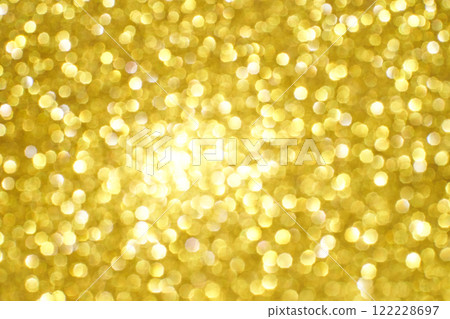 Bright golden bokeh background with soft, blurred light spots creating a warm 122228697