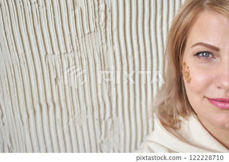 Caucasian female adult with henna design on face and beige background Caucasian female adult with henna design on face and beige background 122228710