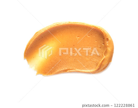 Smooth creamy peanut butter spread on white background for nutty snack lovers Smooth creamy peanut butter spread on white background for nutty snack lovers 122228861