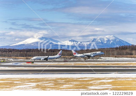 Planes at New Chitose Airport in winter, Mount Tarumae and Mount Fusubushi, Chitose, Hokkaido 122229029