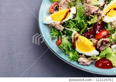 Canned Tuna salad with eggs and tomatoes photography . Top view 122229761