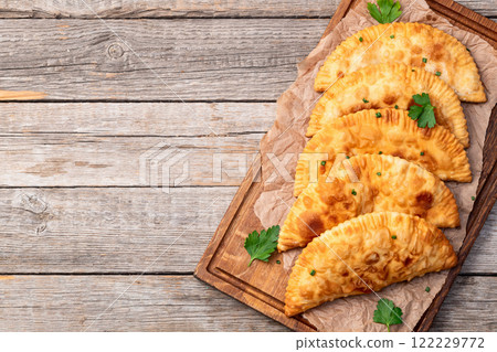 Snack chebureks. Pasties with meat photography . Top view Snack chebureks. Pasties with meat photography . Top view 122229772