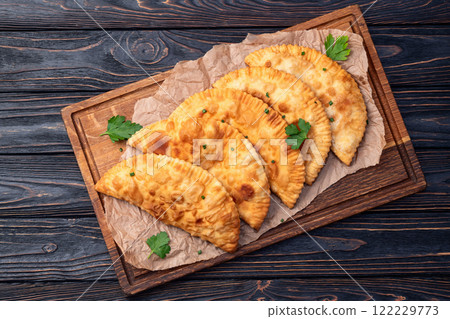 Snack chebureks. Pasties with meat photography . Top view Snack chebureks. Pasties with meat photography . Top view 122229773