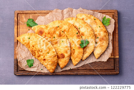Snack chebureks. Pasties with meat photography . Top view Snack chebureks. Pasties with meat photography . Top view 122229775