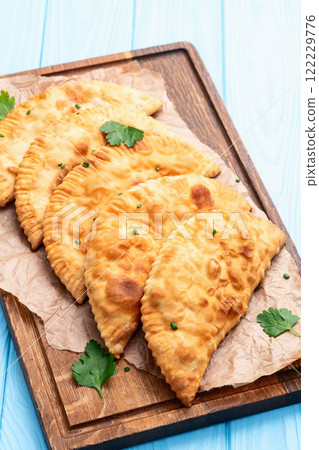 Snack chebureks. Pasties with meat photography . Top view 122229776