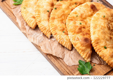 Snack chebureks. Pasties with meat photography . Top view Snack chebureks. Pasties with meat photography . Top view 122229777