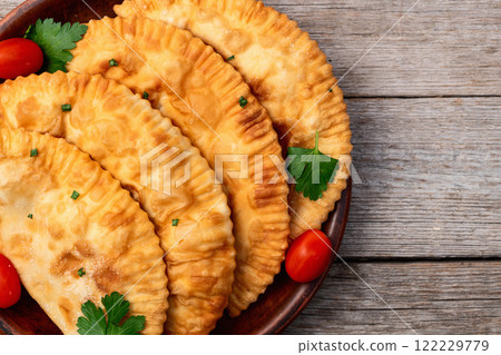 Snack chebureks. Pasties with meat photography . Top view 122229779