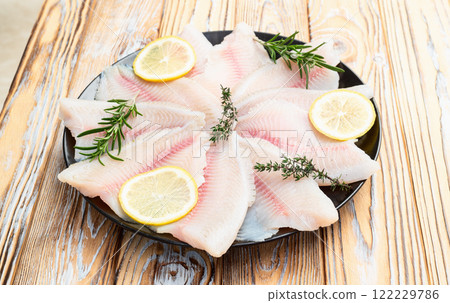 Raw tilapia fillet photography . Top view 122229786
