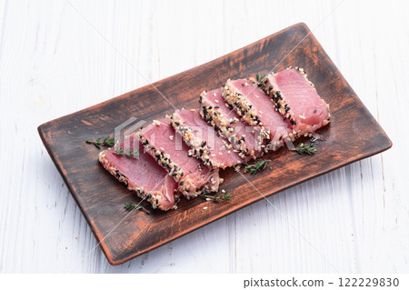 Sliced tuna steak with sesame photography . Top view 122229830
