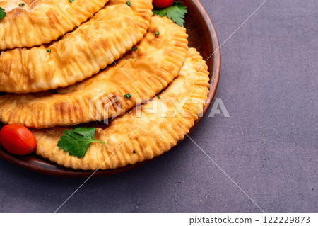 Snack chebureks. Pasties with meat photography . Top view Snack chebureks. Pasties with meat photography . Top view 122229873