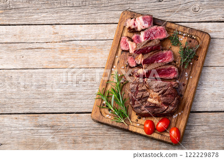 Ribeye grilled  beef steak sliced . Rare doneness photography . Top view 122229878