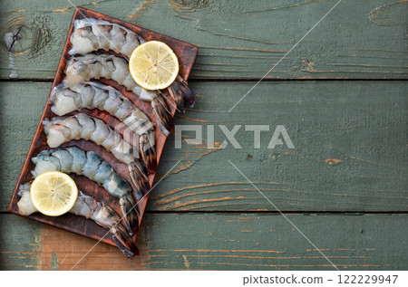 Raw big tiger ( king ) shrimps Cleaned, Peeled & Deveined photography . Top view 122229947