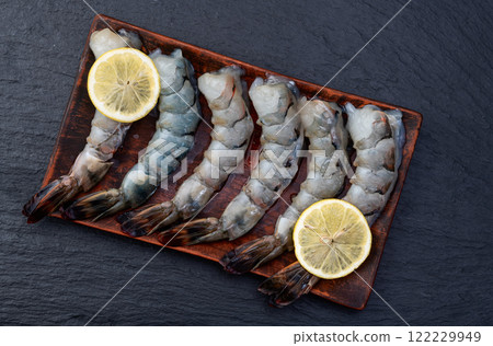 Raw big tiger ( king ) shrimps Cleaned, Peeled & Deveined photography . Top view 122229949