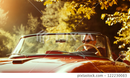 Man driving stylish red convertible against blurred nature background, concept of traveling by retro car on Italian roads Man driving stylish red convertible against blurred nature background, concept of traveling by retro car on Italian roads 122230083