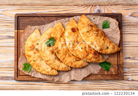 Snack chebureks. Pasties with meat photography . Top view 122230134