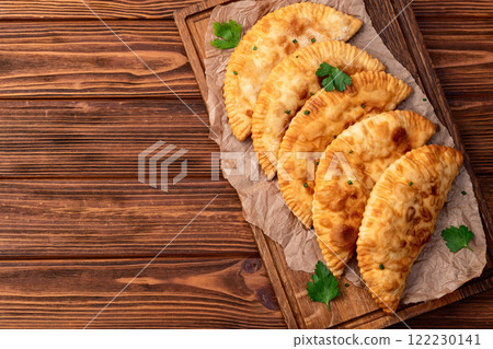 Snack chebureks. Pasties with meat photography . Top view Snack chebureks. Pasties with meat photography . Top view 122230141