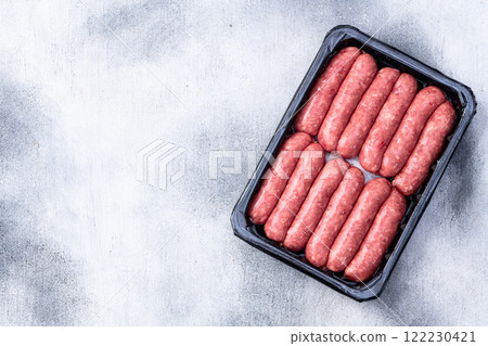 Raw beef sausages with rosemary and tomatoes photography . Top view Raw beef sausages with rosemary and tomatoes photography . Top view 122230421