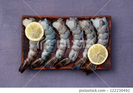 Raw big tiger ( king ) shrimps Cleaned, Peeled & Deveined photography . Top view 122230492