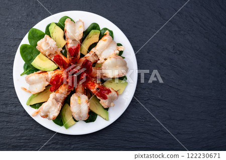 Salad with tiger shrimps , avocado and mango . Top view Salad with tiger shrimps , avocado and mango . Top view 122230671