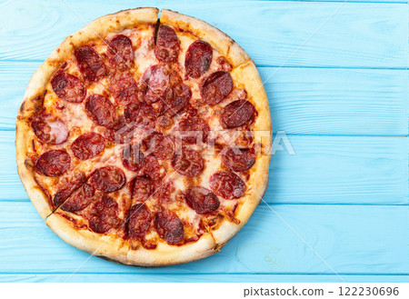 Pizza pepperoni fast food . Top view on rustic background Pizza pepperoni fast food . Top view on rustic background 122230696