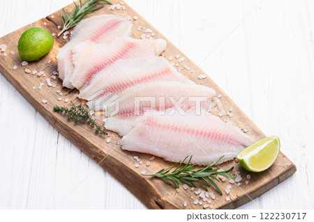 Raw tilapia fillet photography . Top view 122230717