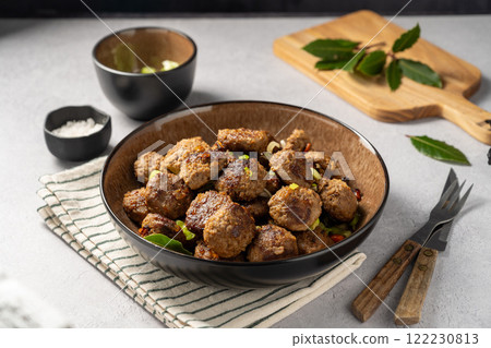 Fried beef meat balls on bright background 122230813