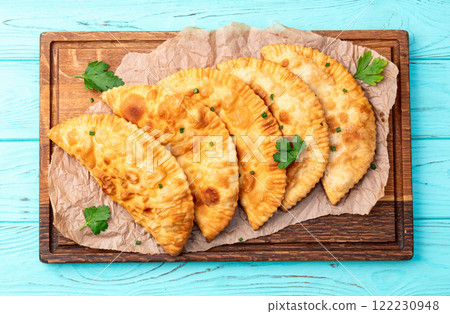 Snack chebureks. Pasties with meat photography . Top view Snack chebureks. Pasties with meat photography . Top view 122230948