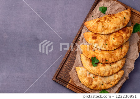 Snack chebureks. Pasties with meat photography . Top view Snack chebureks. Pasties with meat photography . Top view 122230951
