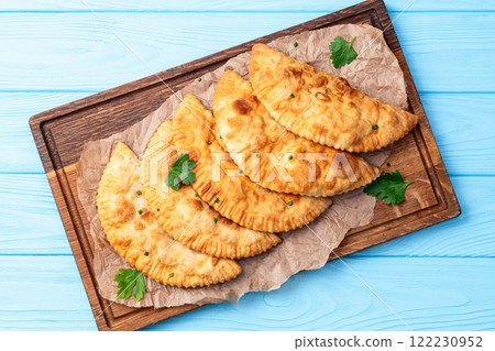 Snack chebureks. Pasties with meat photography . Top view Snack chebureks. Pasties with meat photography . Top view 122230952