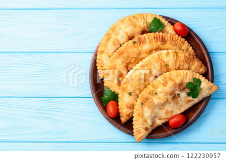 Snack chebureks. Pasties with meat photography . Top view Snack chebureks. Pasties with meat photography . Top view 122230957