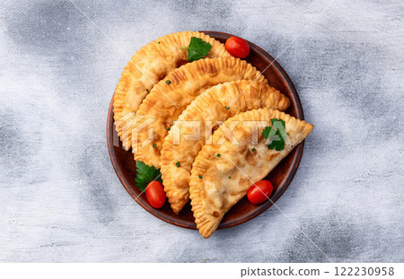 Snack chebureks. Pasties with meat photography . Top view Snack chebureks. Pasties with meat photography . Top view 122230958