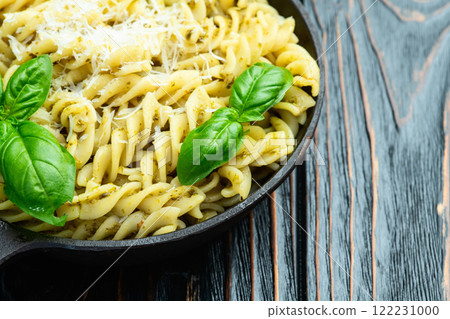 Pasta with basil sauce pesto . Italian food photography . Top view 122231000