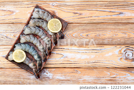 Raw big tiger ( king ) shrimps Cleaned, Peeled & Deveined photography . Top view 122231044