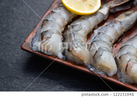 Raw big tiger ( king ) shrimps Cleaned, Peeled & Deveined photography . Top view 122231048