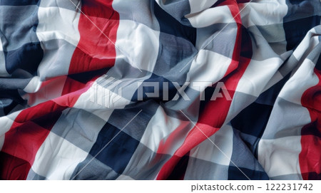 Wrinkled fabric with a red, white, and blue checkered pattern. Soft textile texture, perfect for backgrounds 122231742