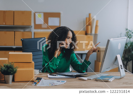 Portrait of Starting small businesses SME owners female entrepreneurs working on receipt box and check online orders to prepare to pack the boxes, sell to customers, SME business ideas online. 122231814