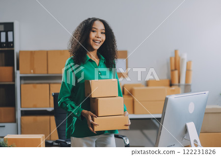 Portrait of Starting small businesses SME owners female entrepreneurs working on receipt box and check online orders to prepare to pack the boxes, sell to customers, SME business ideas online. 122231826
